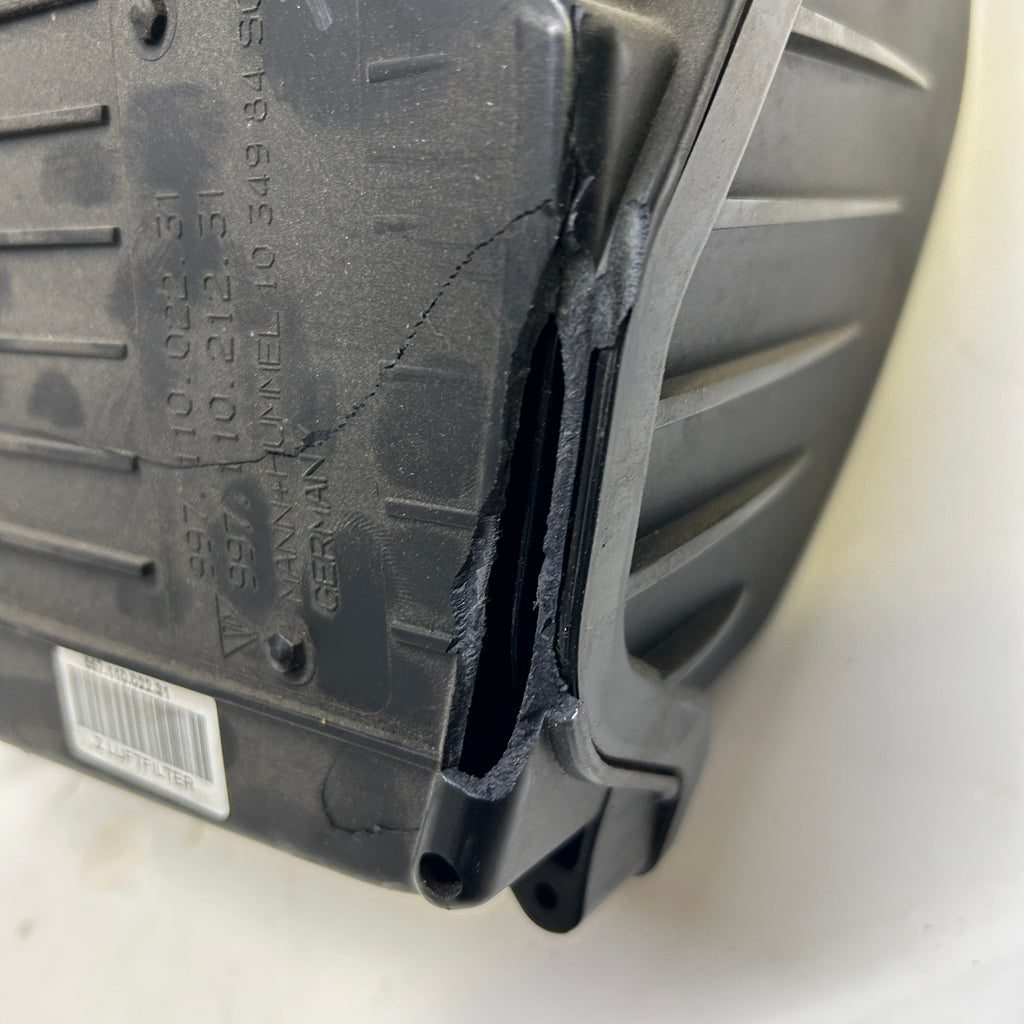PORSCHE AIR FILTER AND HOUSING ASSEMBLY SLIGHT DAMAGE SHOWN  99711002231