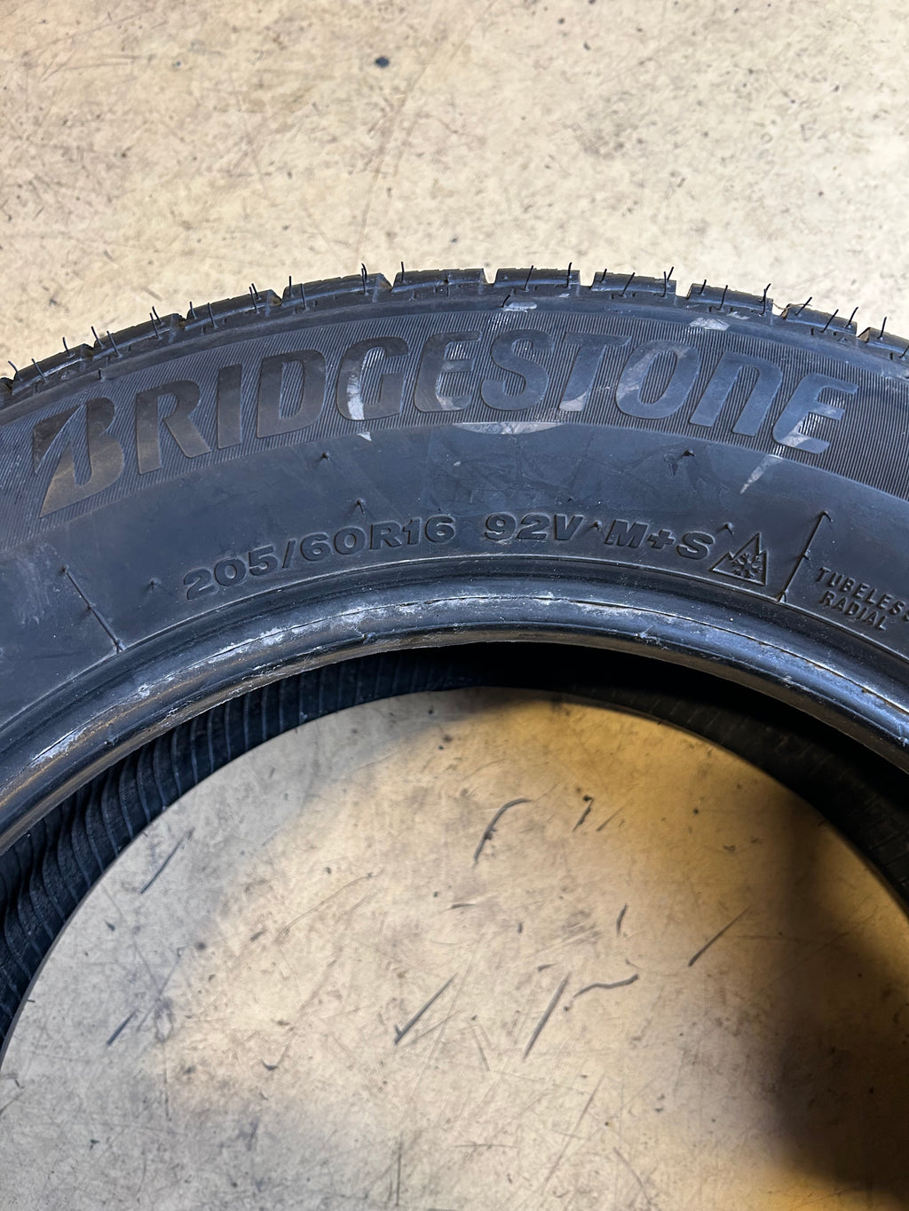 USED 8/32” BRIDGESTONE WEATHERPEAK P 205 60 16 92V ALL WEATHER TIRE 006022