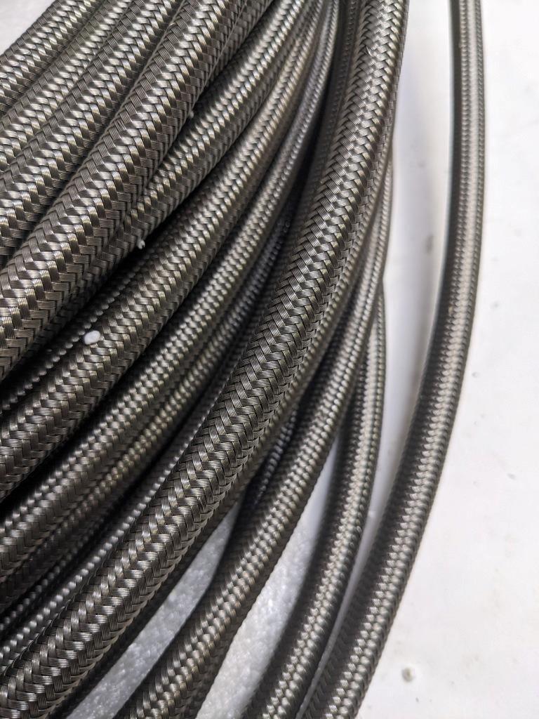 UNBRANDED BRAIDED 210' SS HOSE 5/16" ID 7/16" OD W/ PLASTIC TUBING NEW R17