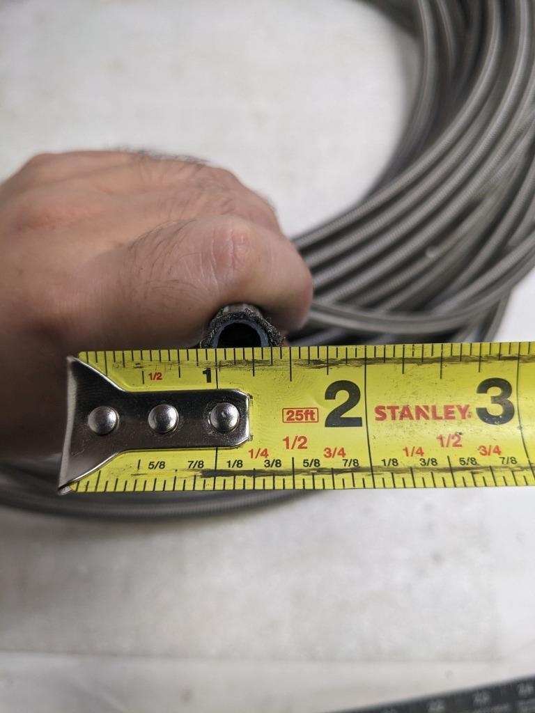 UNBRANDED BRAIDED 210' SS HOSE 5/16" ID 7/16" OD W/ PLASTIC TUBING NEW R17