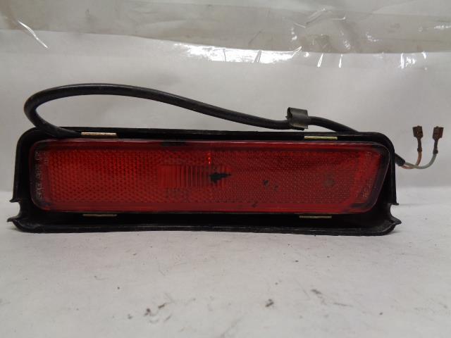 USED PORSCHE LEFT REAR SIDE MARKER w/ HOUSING ASSEMBLY 944 631 425 00 R25T4