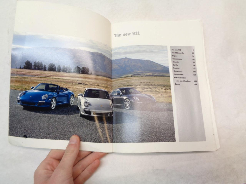 USED PORSCHE PAPERBACK BROCHURE "THE NEW 911" 2008 MKT 001 135 08 R25