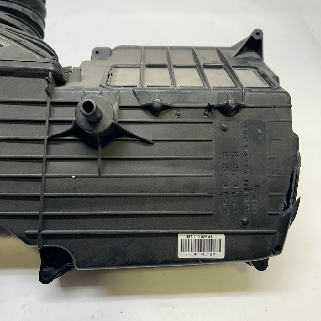 PORSCHE AIR FILTER AND HOUSING ASSEMBLY SLIGHT DAMAGE SHOWN  99711002231