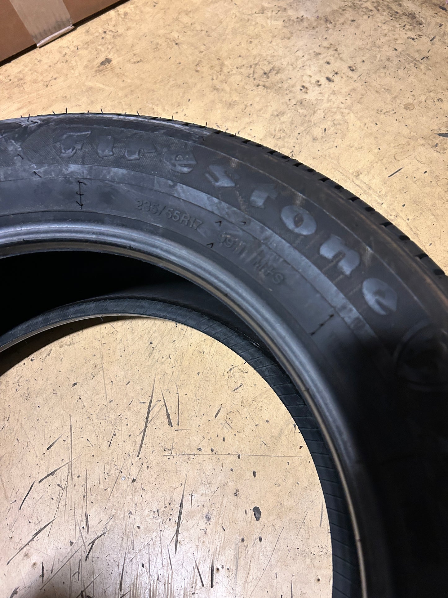 2 NOS FIRESTONE CHAMPION FUEL FIGHTER P 235 55 17 99H ALL SEASON TIRE 015641