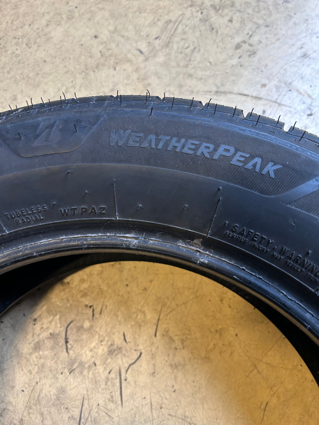USED 8/32” BRIDGESTONE WEATHERPEAK P 205 60 16 92V ALL WEATHER TIRE 006022