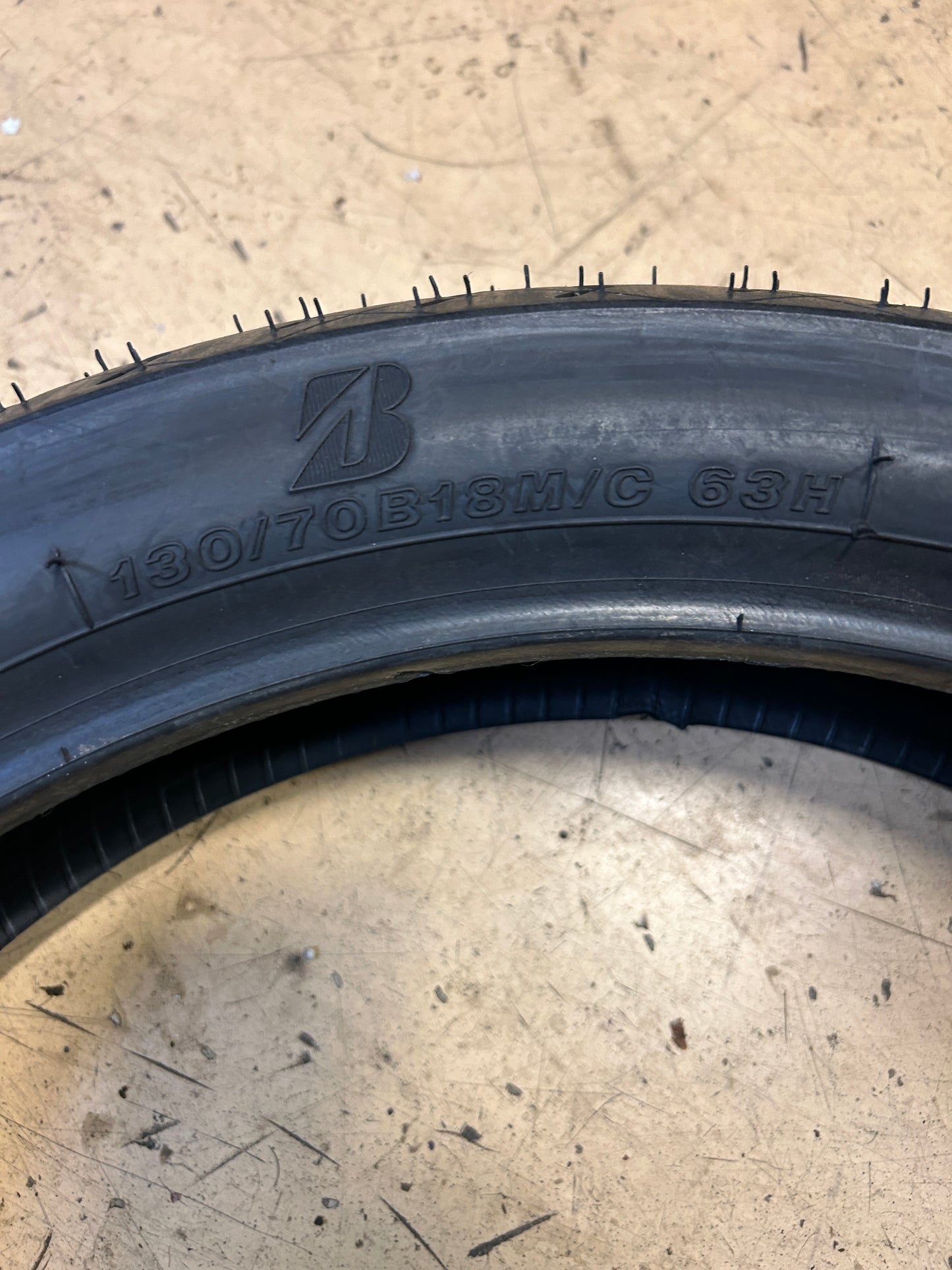 NOS BRIDGESTONE BATTLECRUISE H50F 130 70 18 63H FRONT MOTORCYCLE TIRE 7082
