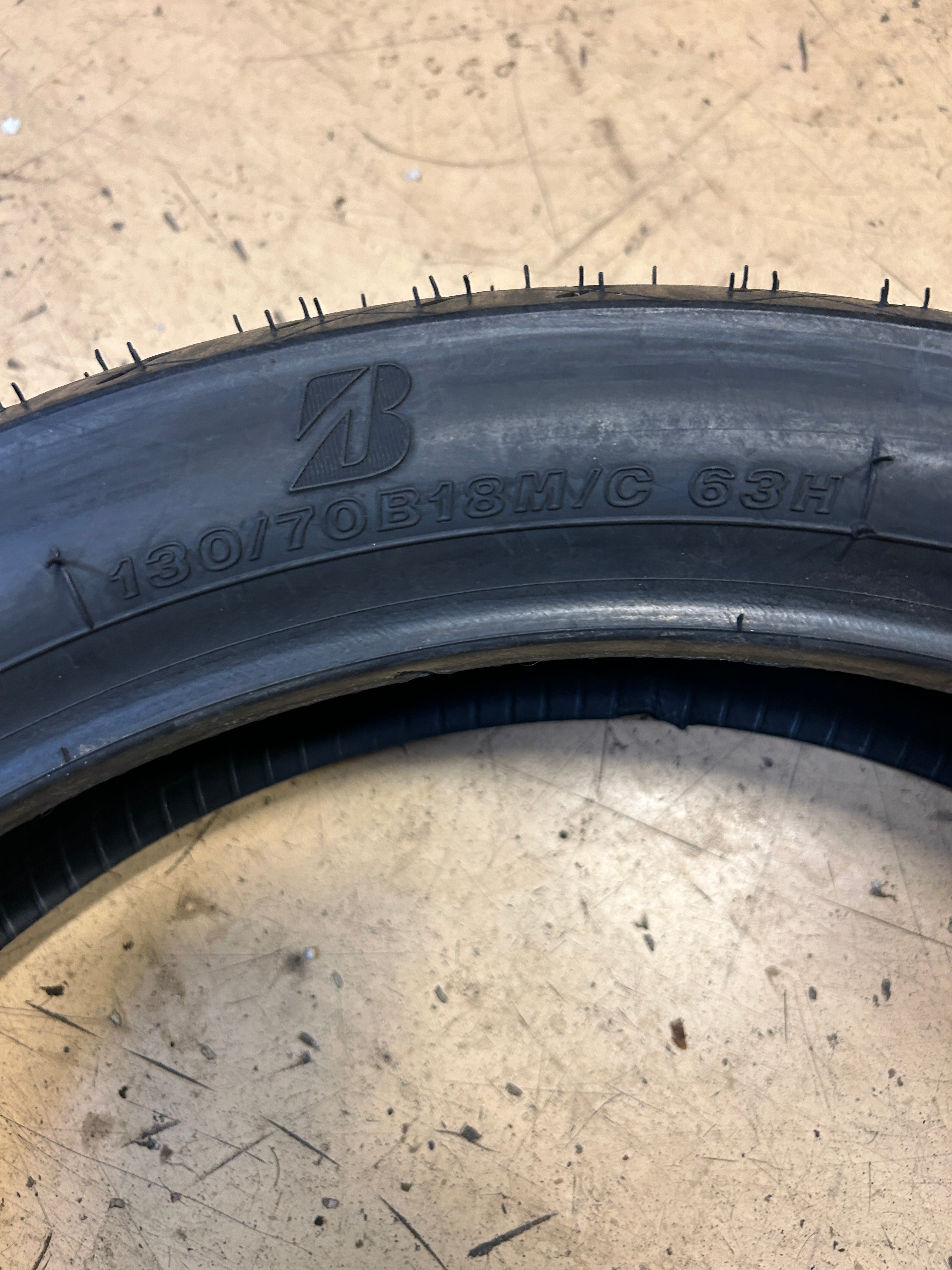 NOS BRIDGESTONE BATTLECRUISE H50F 130 70 18 63H FRONT MOTORCYCLE TIRE 7082