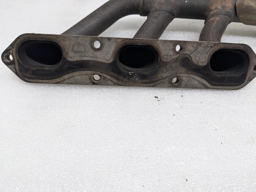 USED PORSCHE BOXSTER EXHAUST MANIFOLD LEFT 99611110106