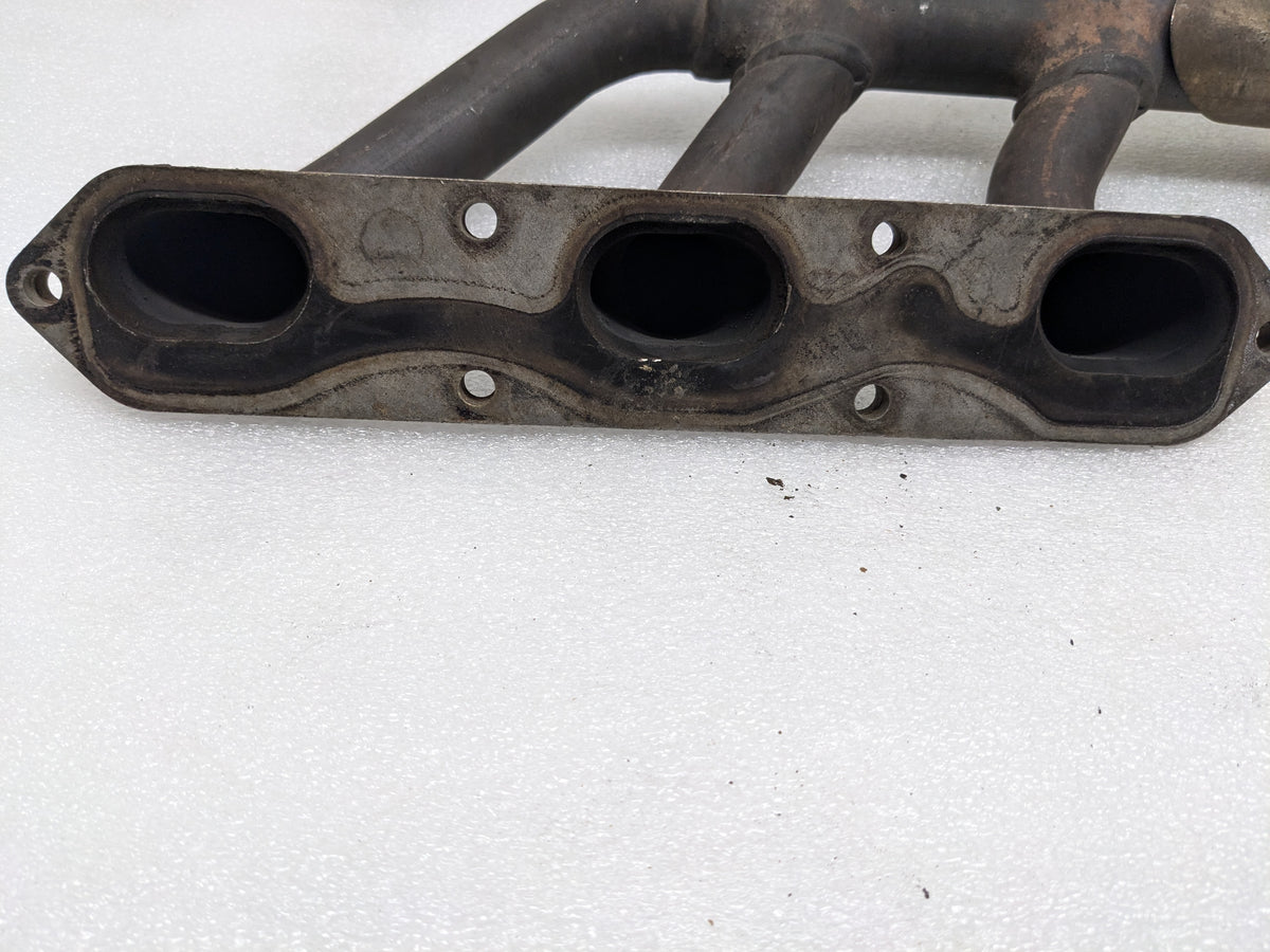 USED PORSCHE BOXSTER EXHAUST MANIFOLD LEFT 99611110106