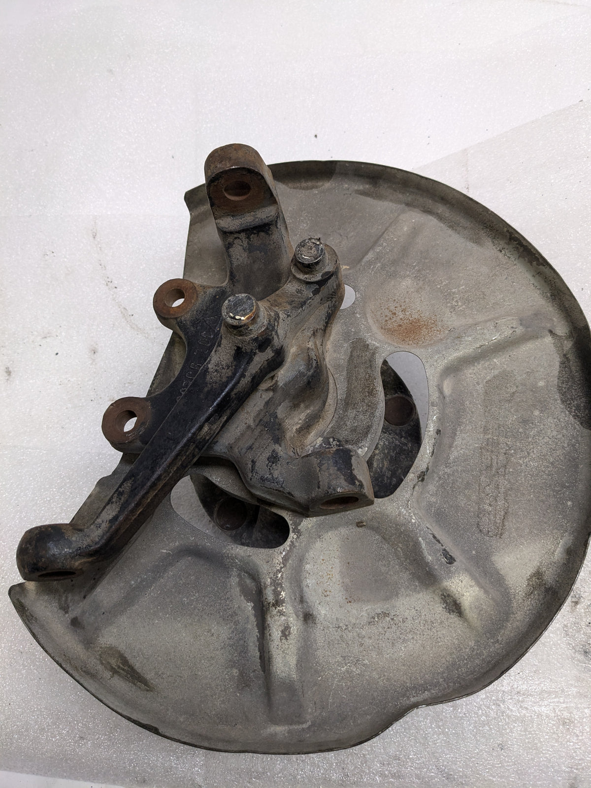 PORSCHE 94434165506 LEFT STEERING KNUCKLE AND DUST SHIELD FOR 1987-1991 944 USED #1 PG2