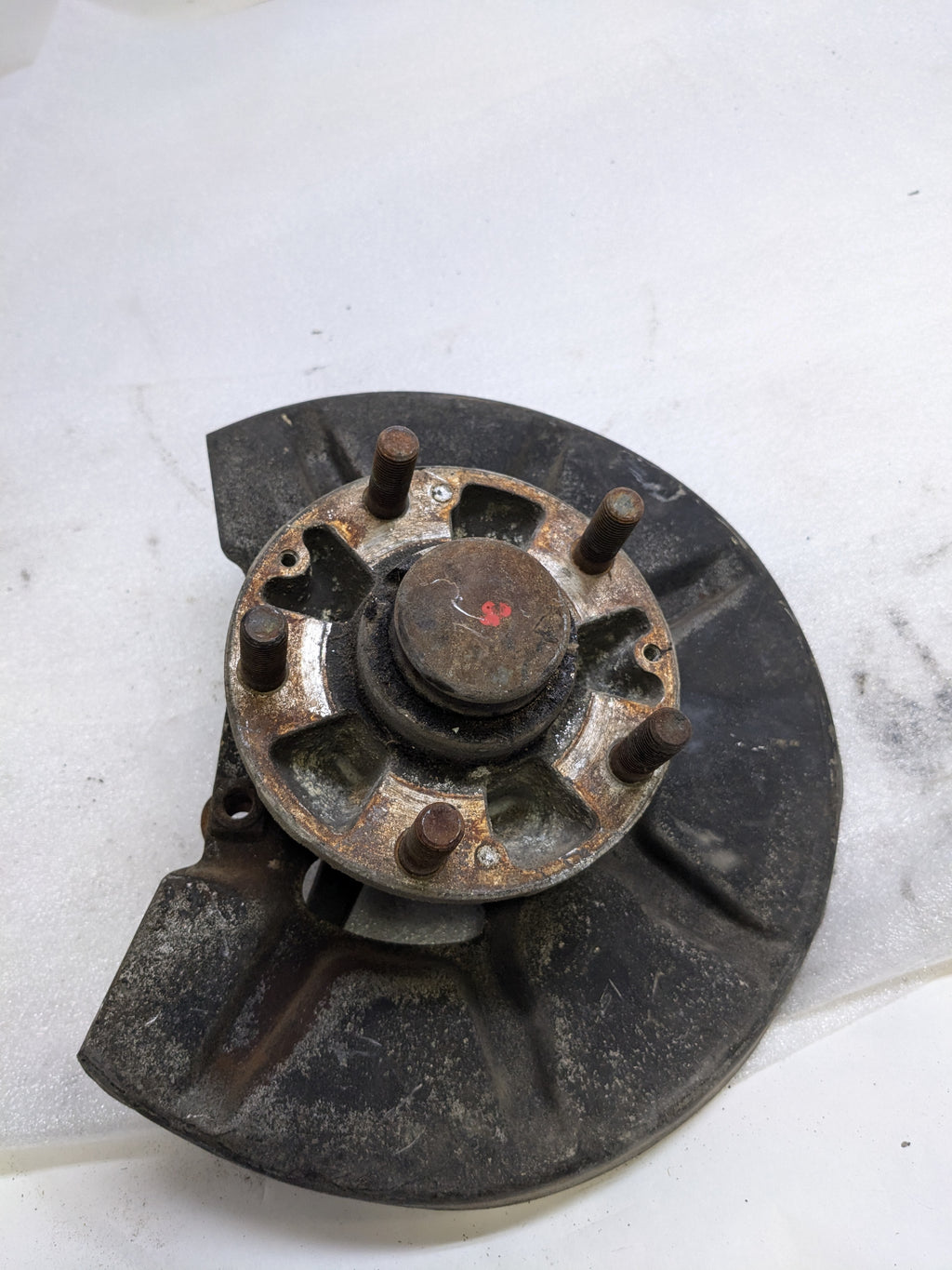 PORSCHE 94434165506 LEFT STEERING KNUCKLE AND DUST SHIELD FOR 1987-1991 944 USED #2 PG2