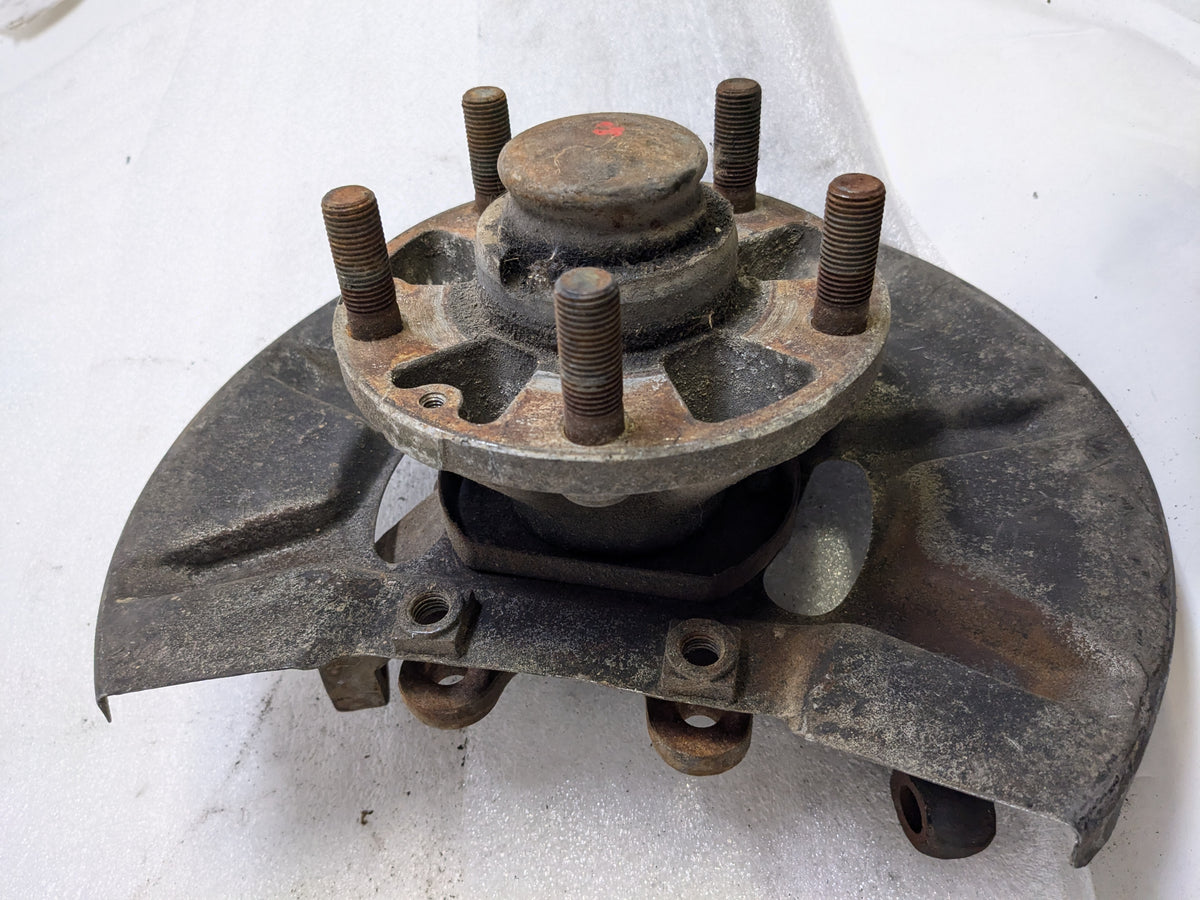 PORSCHE 94434165506 LEFT STEERING KNUCKLE AND DUST SHIELD FOR 1987-1991 944 USED #2 PG2