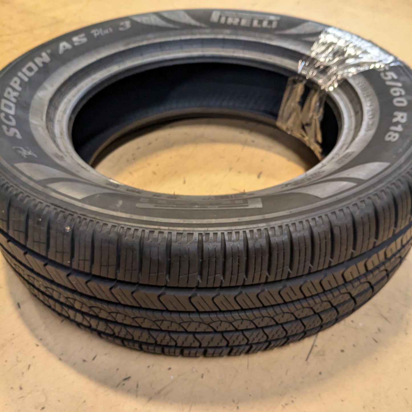 USED 11/32" OF 12/32" PIRELLI SCORPION ALL SEASON PLUS 3 P 265 60 18 110V SL ALL SEASON TIRE 3918700