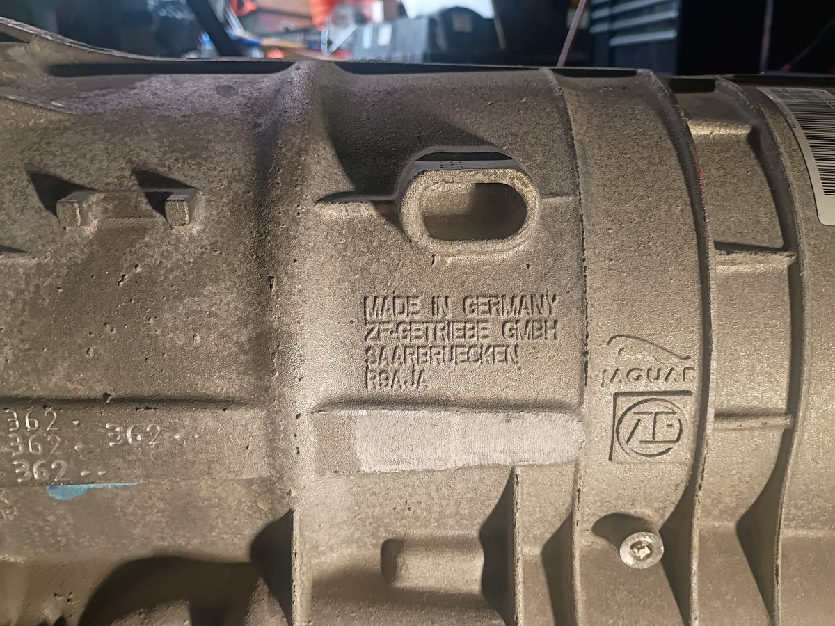 USED TRANSMISSION ASSY. 10-12 XF XJ 5.0 AUTOMATIC 9X23-7000-CE