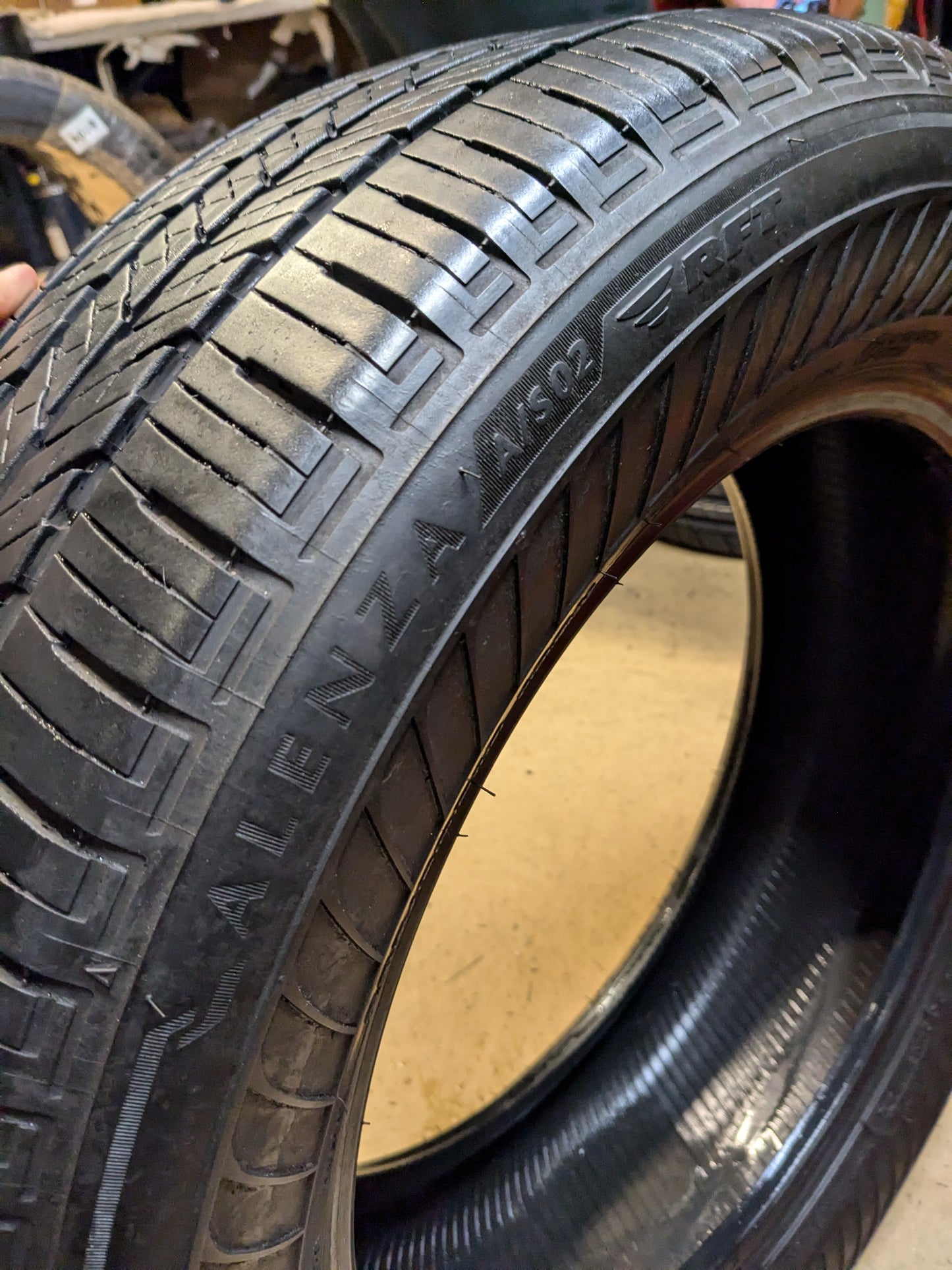 USED 7/32” OF 8/32” BRIDGESTONE ALENZA A/S 02 RUNFLAT P 235 60 18 103H SL ALL SEASON TIRE 012165